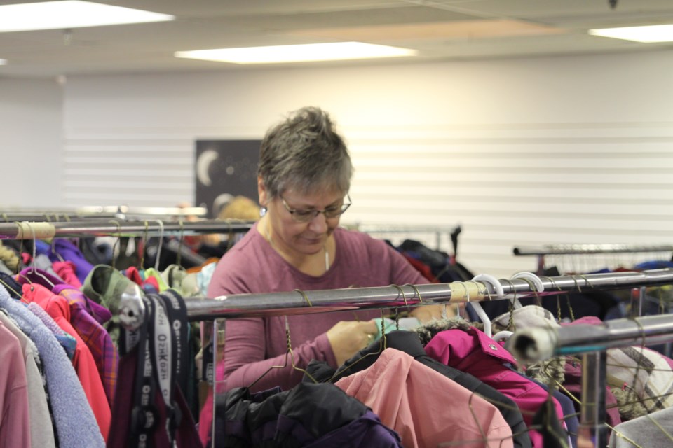 Marianne Jollineau sorting through some donations