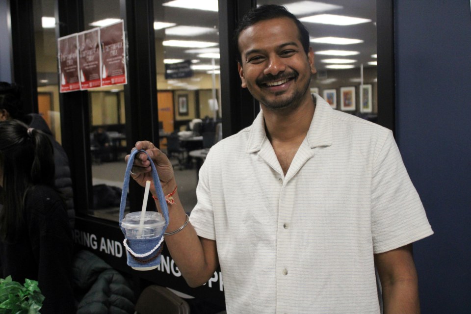 Sundaram Naikar was all smiles as he showcased his handcrafted cup holders that were for sale during Confederation College's Enterprise Challenge Upcycled Market Days.