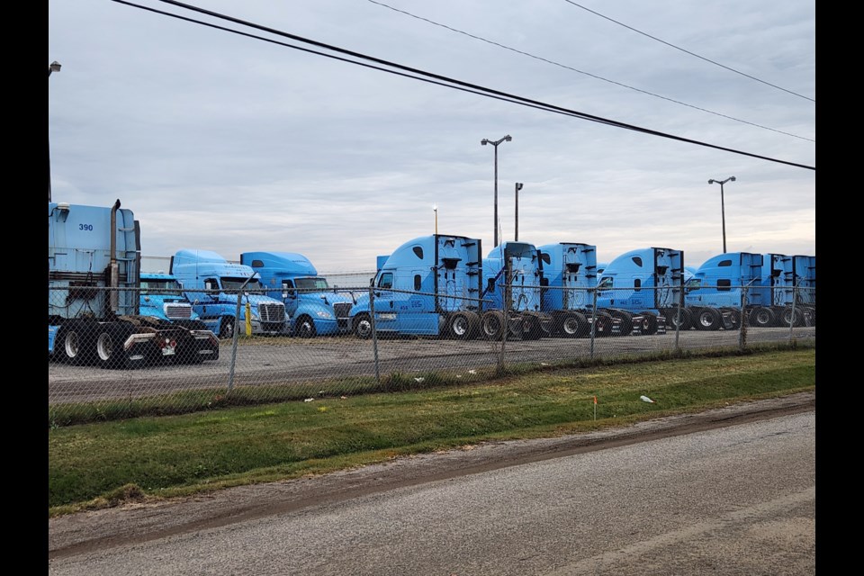 Dozens of tractors and trailers are idled at McKevitt Trucking's Thunder Bay headquarters (TBnewswatch photo)