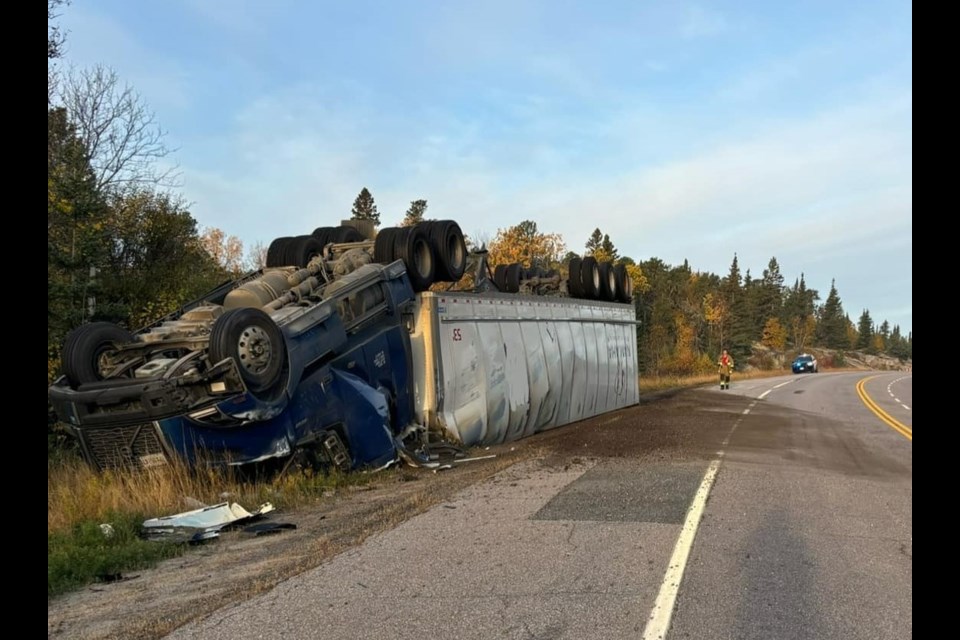 A tractor-trailer ended up on its roof after a single-vehicle collision west of Dryden on Oct. 12, 2024 (OPP/Facebook)