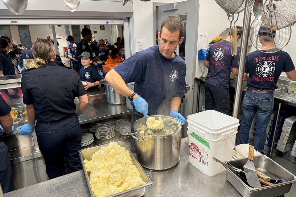 Thunder Bay Fire Rescue's Matt Agar volunteers on Sunday, Oct. 13, 2024 at the Salvataion Army's Journey to Life Centre. (Leith Dunick, tbnewswatch.com)