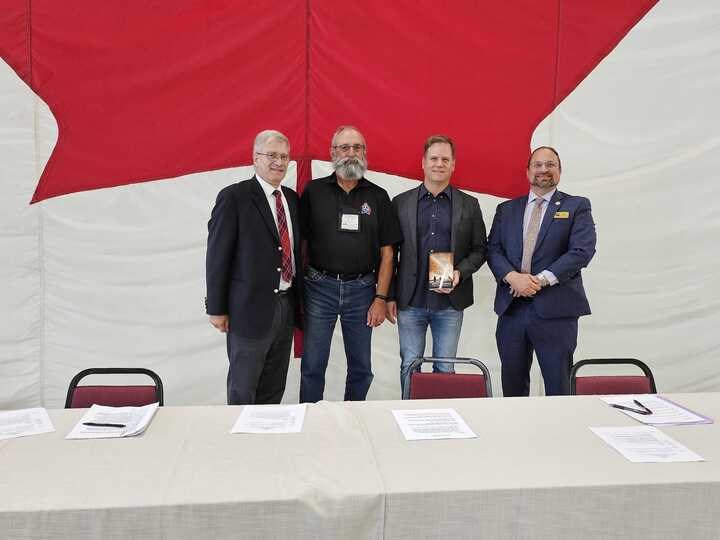 From left,  Dr. David Ratz, Capt. George Romick (Retired), Scott Saxberg, Scott Bradley