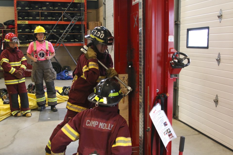 Young women were breaking down doors at Camp Molly this week as they learned what it takes to become a firefighter. 