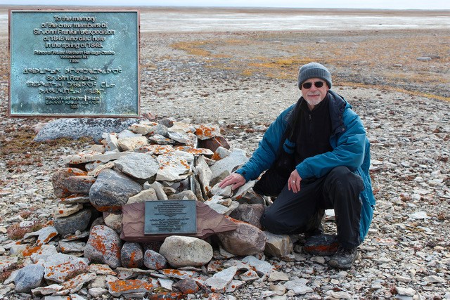 Researcher Douglas Stenton of the Univ. of Waterloo is shown at a commemorative cairn where the remains of James Fitzjames and 12 other Franklin expedition members rest (R.Park photo)