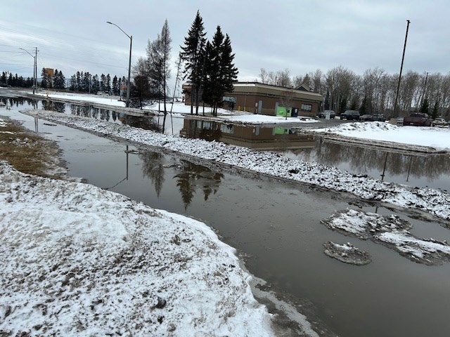 Flooding along a stretch of Carrick Street near the Real Canadian Superstore on Feb. 25, 2025.