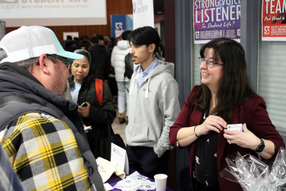 Doane Grant Thornton people and culture manager Rita Romeo chats with a potential future employee during Confederation College's annual career and job fair on Feb. 4, 2025.