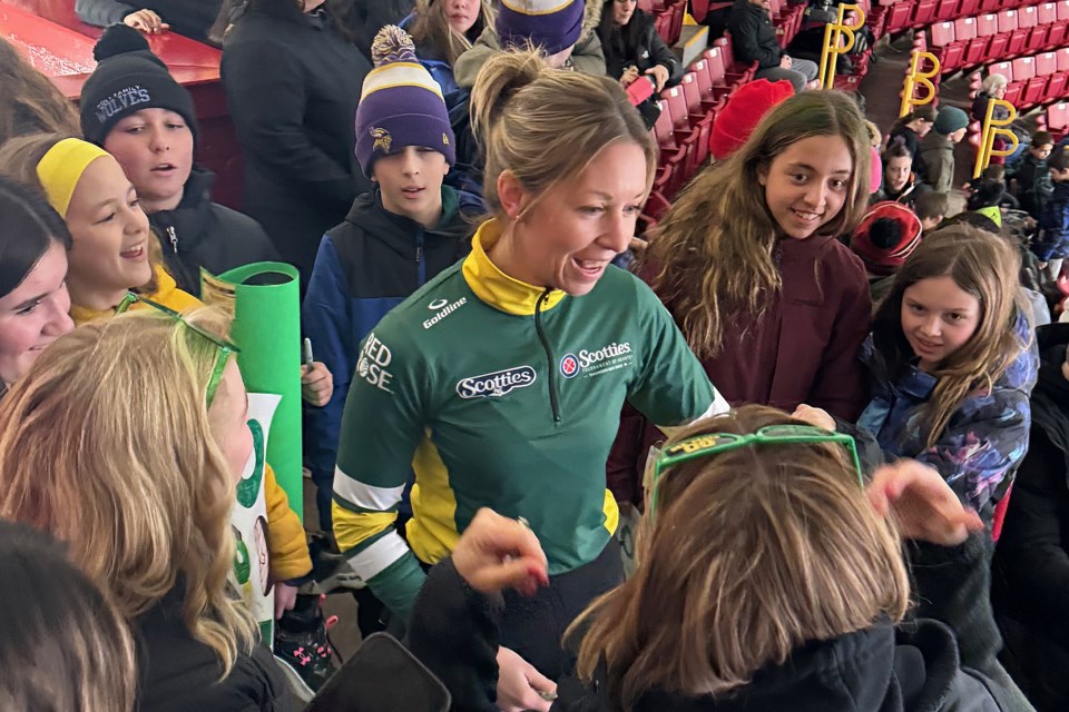 Krista McCarville spends time with students from Holy Family School, where she's a teacher, during Draw 13 play at the Scotties Tournament of Hearts. McCarville is the skip of Team Northern Ontario and a two-time Scotties runner-up. (Leith Dunick, tbnewswatch.com)