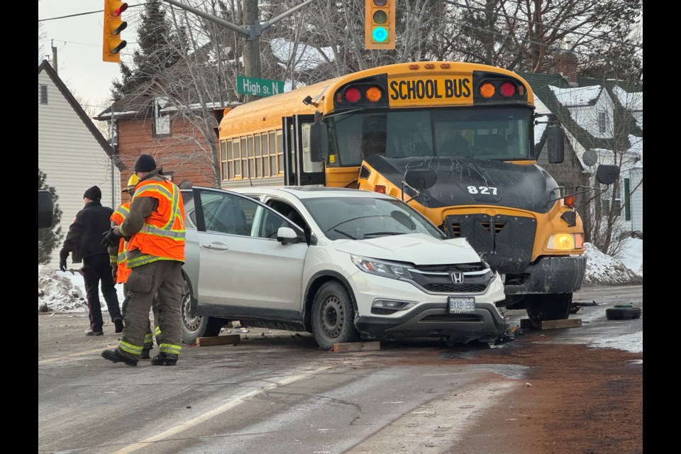 Police are investigating a crash involving a school bus on Friday, Feb. 21, 2025 at the intersection of High Street North and River Street in Thunder Bay. (LeithDunick/tbnewswatch.com)