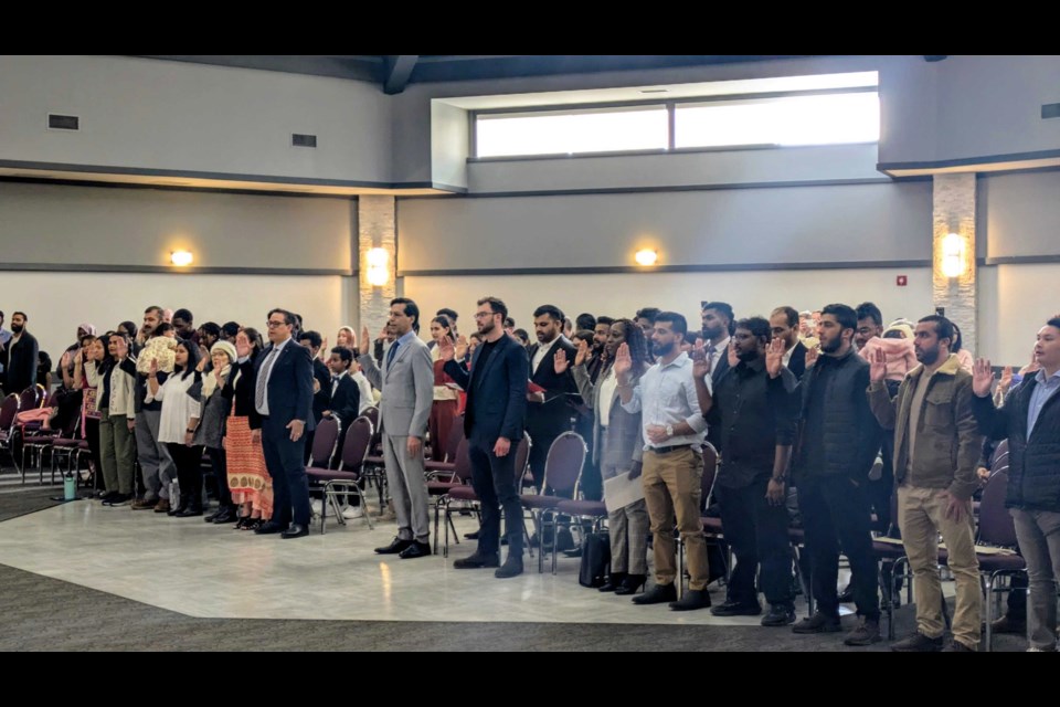 60 new Canadian citizens took their oath in person for the first time in five years. 