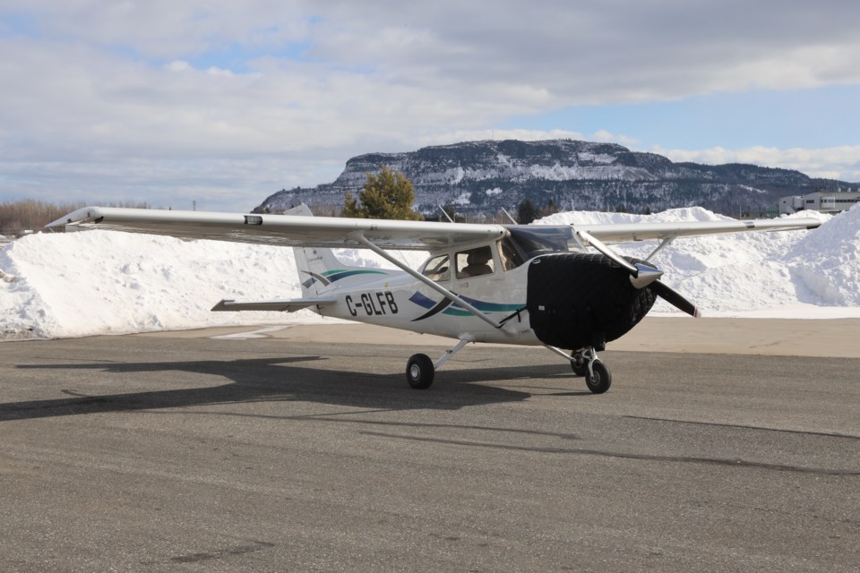 A Cessna 172 Skyhawk sits on the tarmac that Confederation College's Aviation Centre of Excellence at the Thunder Bay International Airport.