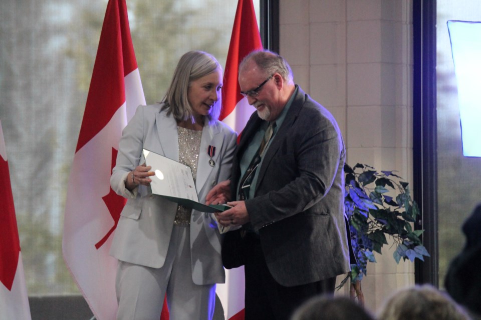 Al Cresswell receiving his King Charles III Coronation Medal from MP Patty Hajdu