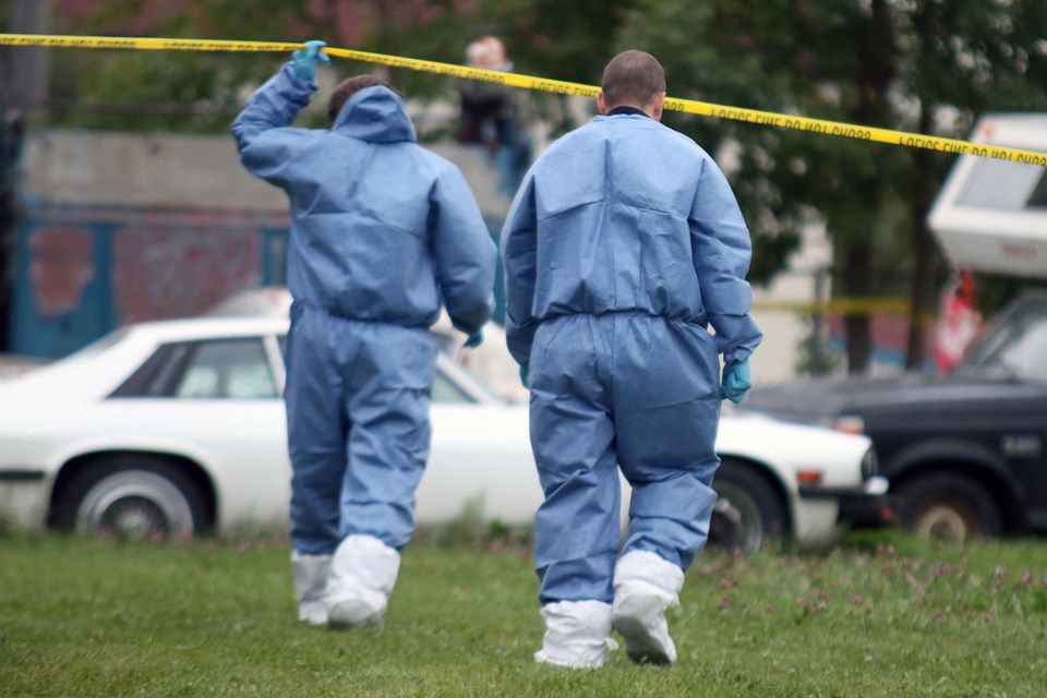 Investigators continue their work at a compound near Court Street South in Thunder Bay on Thursday, Sept. 16, 2016 after a body was found. 