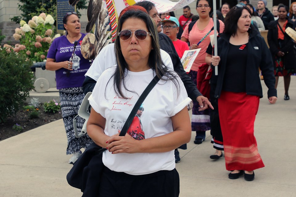 Sharon Johnson leads the Full Moon Memory Walk on Friday, Sept. 16, 2016 in Thunder Bay, Ont. Her sister Sandra was killed on Feb. 13, 1992. The case has never been solved. 