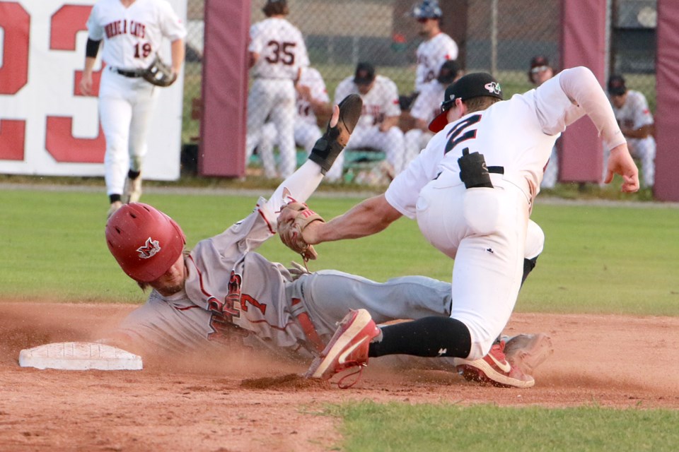 Thunder Bay's Patrick Engskov tags out Minnesota's Tanner Recchio on an attempted steal on Tuesday, July 19, 2023 at Port Arthur Stadium. Minnesota went on to win the game 13-9. (Leith Dunick, tbnewswatch.com)