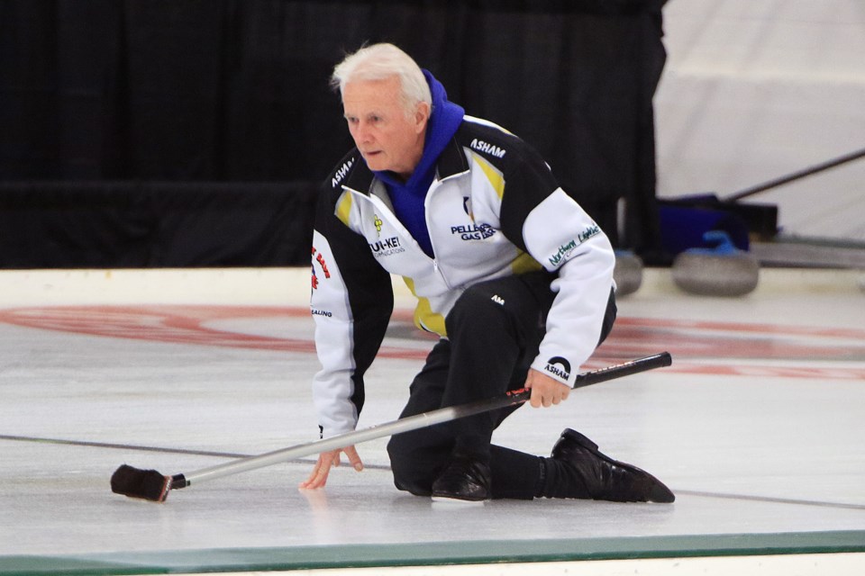 Thunder Bay's Frank Morissette studies his shot during Draw 7 play at the Northern Ontario Men's Curling Championship at the Port Arthur Curling Centre. (Leith Dunick, tbnewswatch.com)