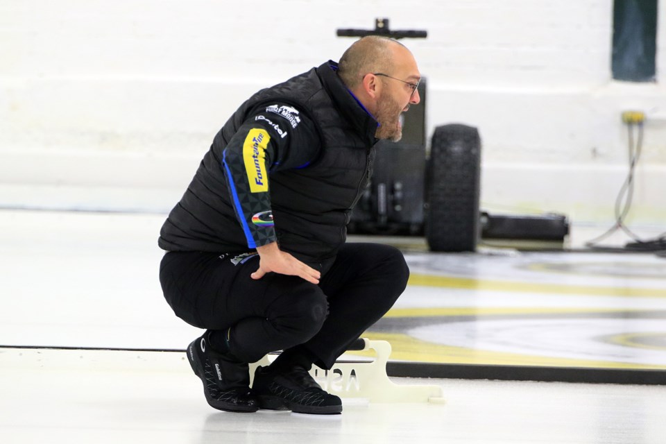 Trevor Bonot gives direction to his sweepers during Draw 8 play at the Northern Ontario Men's Curling Championship at Port Arthur Curling Centre. (Leith Dunick, tbnewswatch.com)