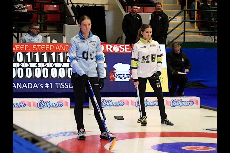 Quebec's Laurie St-Georges (left) and Manitoba's Kaitlyn Lawes during Draw 2 action at the Scotties Tournament of Hearts at Fort William Gardens on Saturday, Feb. 15, 2025. (Leith Dunick, tbnewswatch.com)