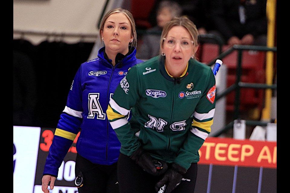 Alberta's Selena Sturmay (left) and Northern Ontario's Krista McCarville in the house in Draw 5 play at the Scotties Tournament of Hearts at Fort William Gardens, on Sunday, Feb. 16, 2025. (Leith Dunick, tbnewswatch.com)