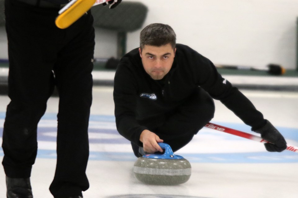 Kory Carr fires off a shot on Wednesday, Nov. 24, 2021 during Tbaytel Major League of Curling play at the Port Arthur Curling Club. (Leith Dunick, tbnewswatch.com)