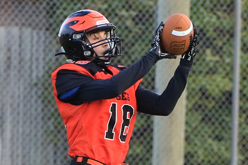 Westgate's Eric Munro hauls in the game's first touchdown, a one-yard catch, in the Tigers 41-0 win over Superior Collegiate in the 4/5 junior football play-in game on Monday, Oct. 21, 2024 at Fort William Stadium. (Leith Dunick, tbnewswatch.com)