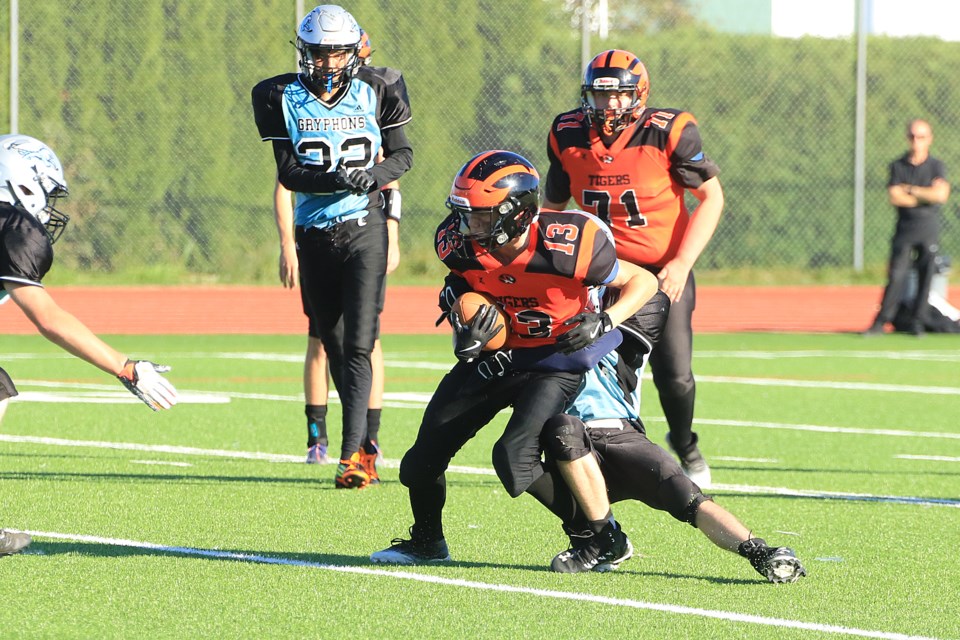 Westgate's Aiden Sheppard is tackled by a Superior Collegiate defender, on Thursday, Sept. 26, 2024. (Leith Dunick, tbnewswatch.com)