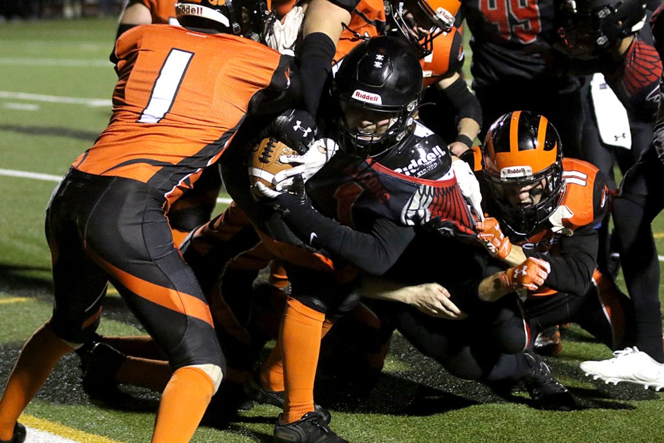 St. Ignatius running back Tyler Robertson fights for yardage on a 12-yard score on Friday, Oct. 29, 2021 in semifinal senior football play at Fort William Stadium. (Leith Dunick, tbnewswatch.com)