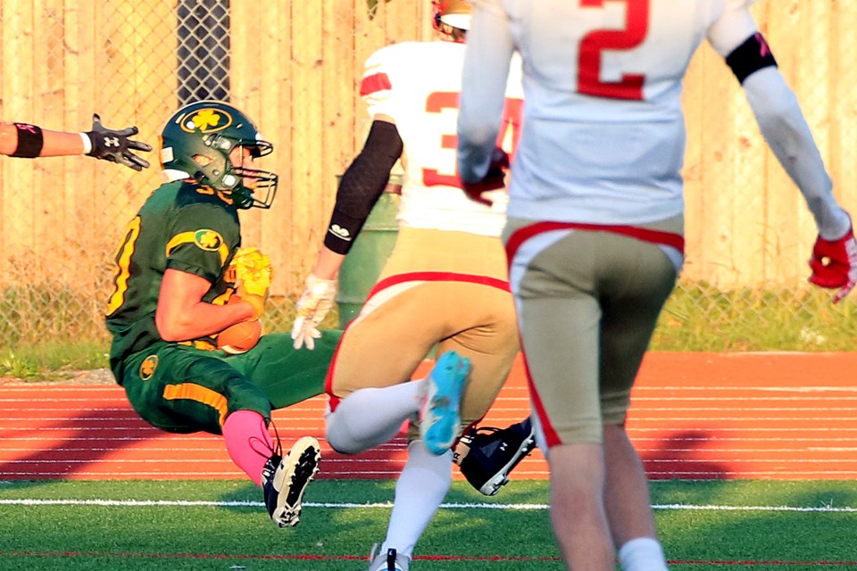 St. Pat's receiver Jude Hockenhull haul's in the game-winning touchdown on Friday, Oct. 4, 2024 against the Hammarskjold Vikings, the score coming with just seconds to go in the senior high school footbally game. (Leith Dunick, tbnewswatch.com)