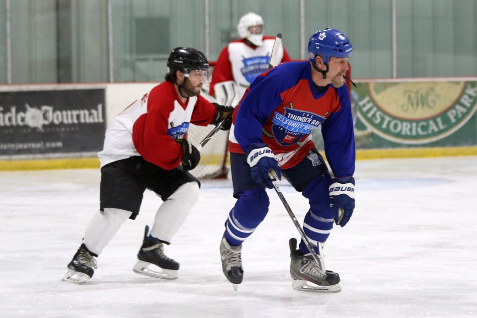 Fomer NHLer Al Iafrate (left) skates on Friday, Oct. 29, 2021 at the Easter Seals Celebrity Classic at the Thunder Bay Tournament Centre. (Leith Dunick, tbnewswatch.com)