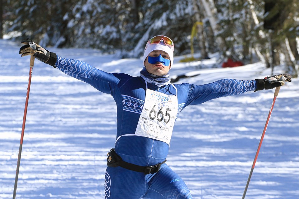 Matthew Liebsch celebrates as he crosses the finish line first at the Sleeping Giant Loppet on Saturday, March 1, 2025. (Leith Dunick, tbnewswatch.com)