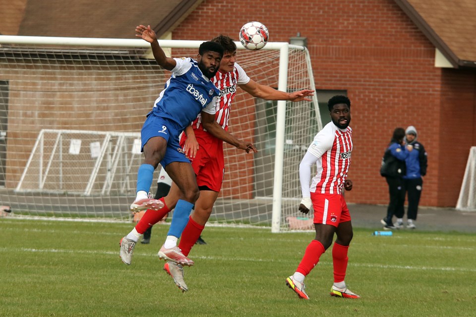 Thunder Bay's Osita Obiekwe (left) and Des Moines' Morris Duggan fight for control deep in Menace territoy on Friday, June 3, 2022 at Chapples Park. (Leith Dunick, tbnewswatch.com)