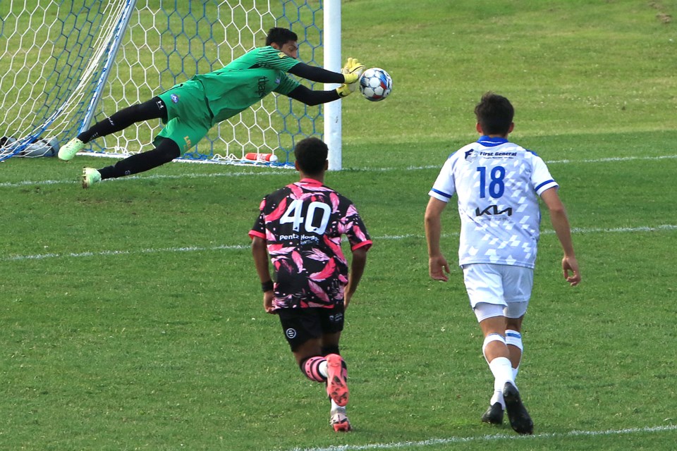 Thunder Bay Chill keeper Joshua Moya makes a diving save on Max Kent's penalty kick in the 58th minute of their game on Friday, July 5, 2024 against Minneapolis City at Tbaytel Field at Chapples Park. (Leith Dunick, tbnewswatch.com)