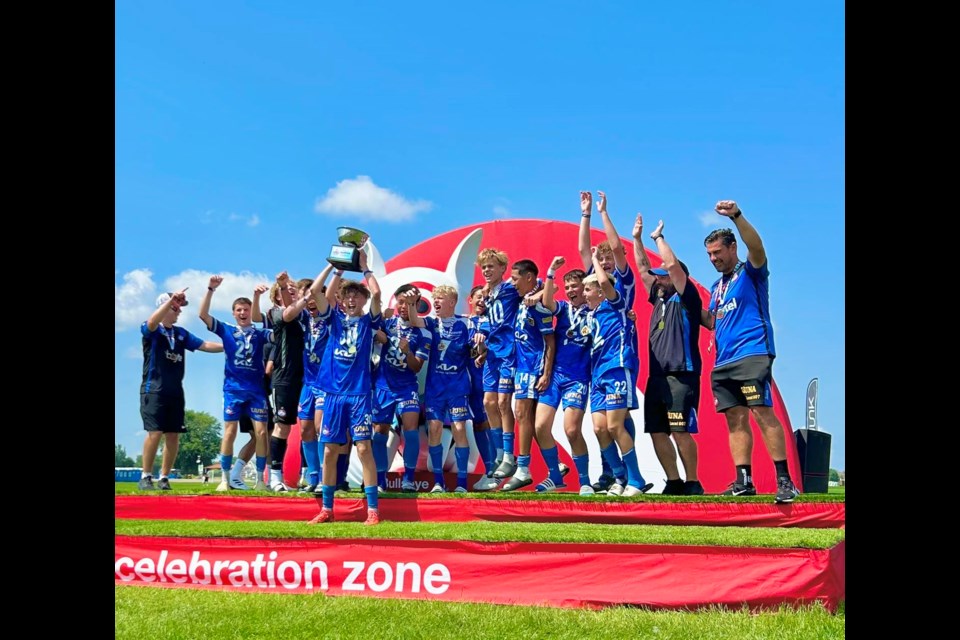 The Thunder Bay Chill U15 boys' team celebrate after winning their division at the USA Cup tournament in Blaine, Minn. 