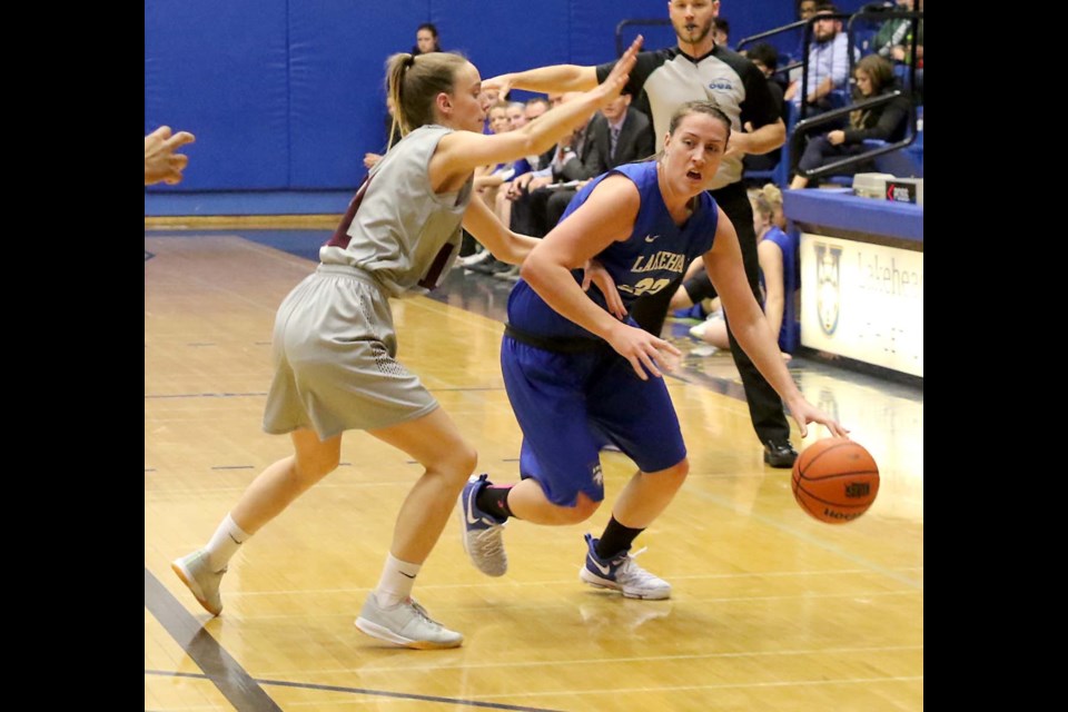 Lakehead's Bridget O'Reilly (right) looks for a way around Ottawa's Amelie Hachey on Saturday, Nov. 25, 2017 at the C.J. Sanders Fieldhouse. 