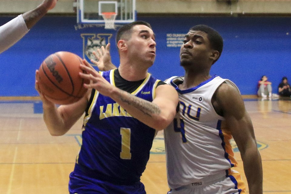 Lakehead's Chris Sagl drives the paint against TMU's Maxime Louis-Jean on Saturday, Jan. 18, 2025. (Leith Dunick, tbnewswatch.com)