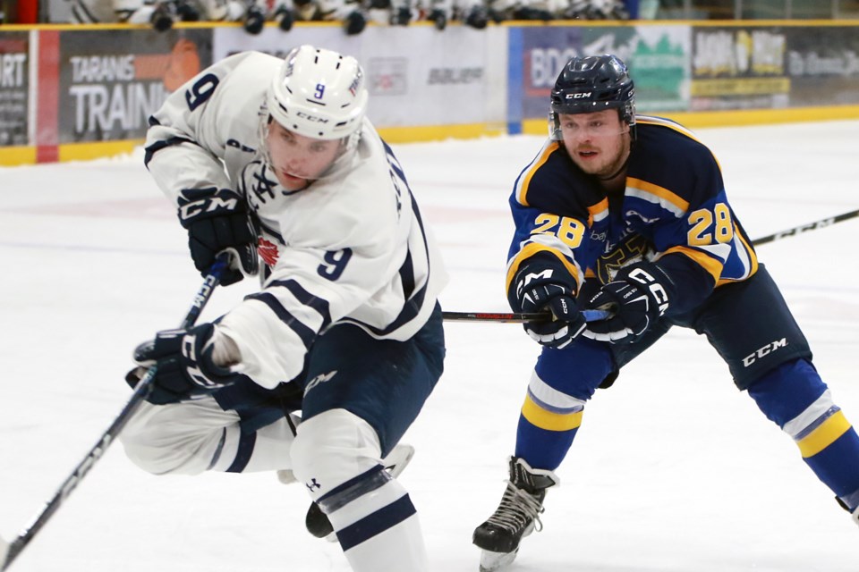 Toronto's Owen Robinson breaks free of Lakehead's Kyle Auger (28) to score the game's first goal on Friday, Jan. 6, 2023 at Fort William Gardens. (Leith Dunick, tbnewswatch.com)