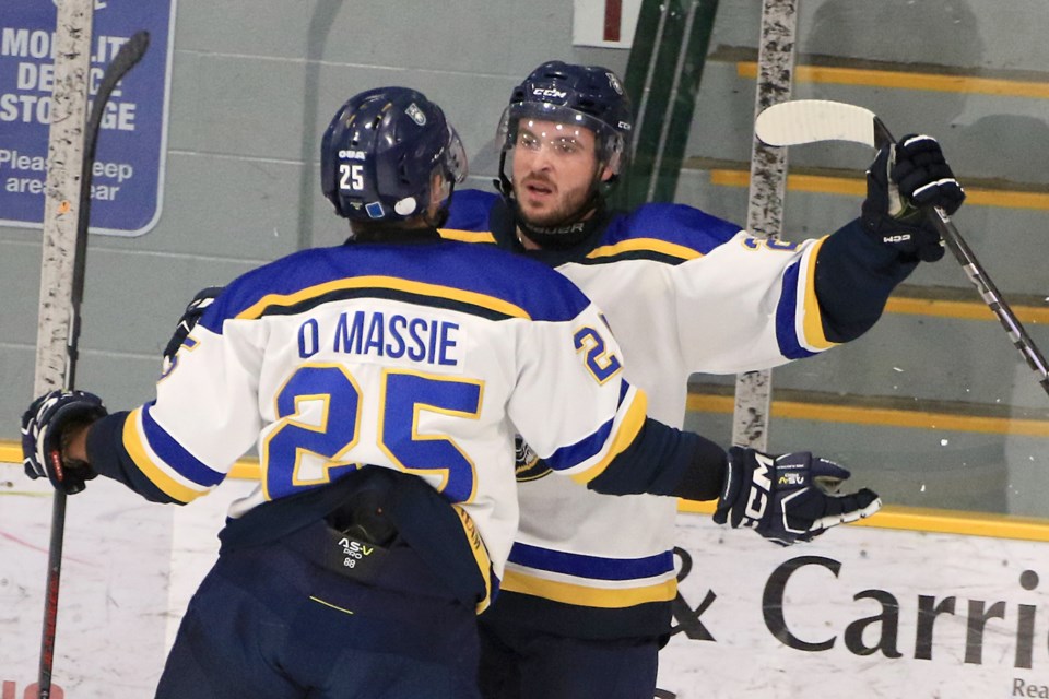 Lakehead's Dylan Massie congratulates Nik Campbell for scoring his first OUA goal on Saturday, Oct. 19, 2024. (Leith Dunick, tbnewswatch.com)