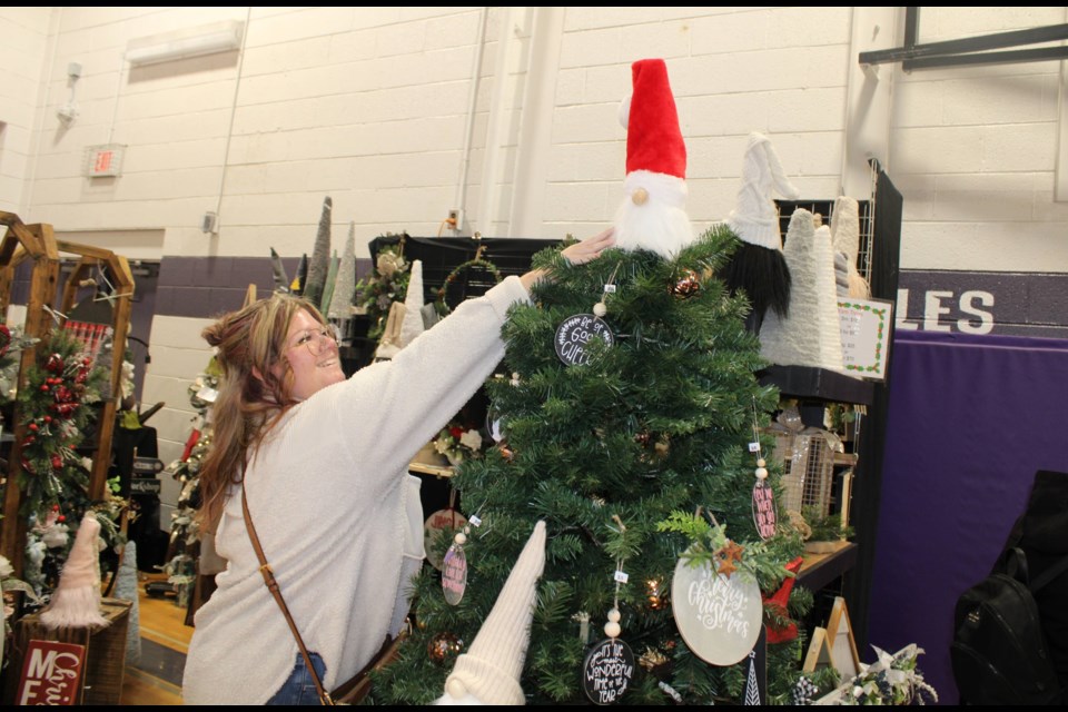 Jennifer Lipset from Thorold was willing to do whatever it took to get her hands on a Santa tree topper at Simply Twinspirational at the Thorold Arts & Crafts Show. 