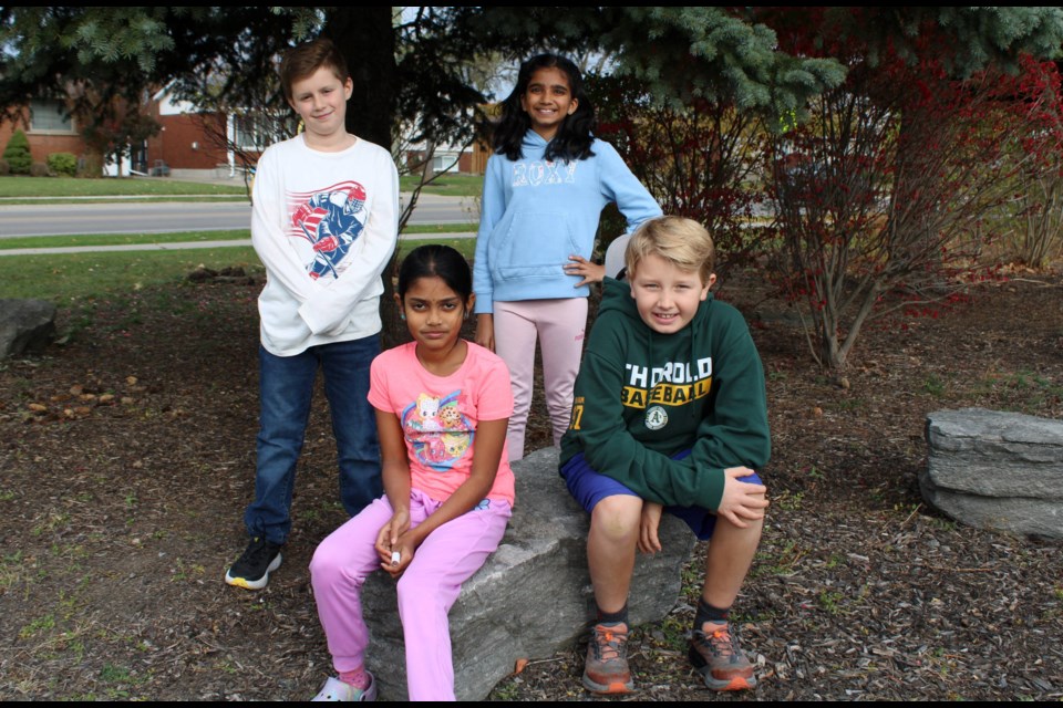 Members of the Richmond Street Public School's Eco Club who attended the DSBN's Eco Summit at Heartland Forest last month included, in front from left, Netra Elavazhagan and Charlie Graham. In back are Seth McMaster and Romeesa Patel. The group are pictured in an outdoor learning area the club is creating at the Thorold school.