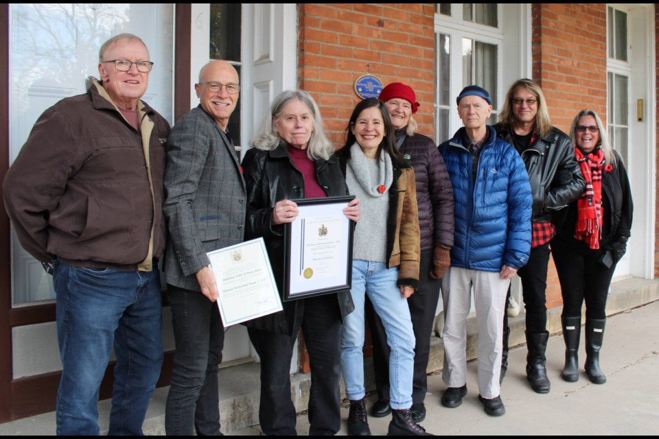 Madeline Zeller, third from left, who owns the Duncan McFarland House in Port Robinson with her partner, Brian Mann, was joined by Heritage Thorold LACAC committee chair Anna O’Hare, centre, and members of the committee at a ceremony marking the designation of the River Street home as one having cultural heritage value under the Ontario Heritage Act.