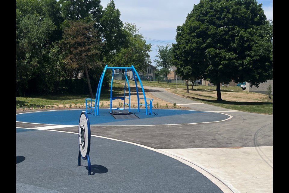 The wheelchair-accessible swing in the playground at Battle of Beaverdams Park.