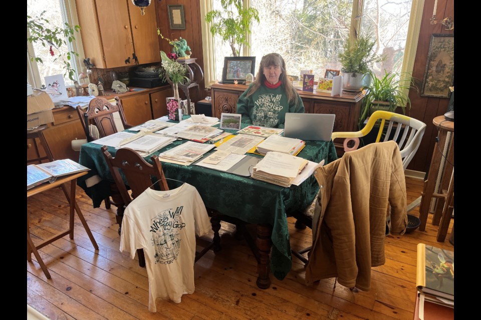 Carla Carlson with her scrapbooks and memorabilia documenting her decades-long fight to save the frog pond.