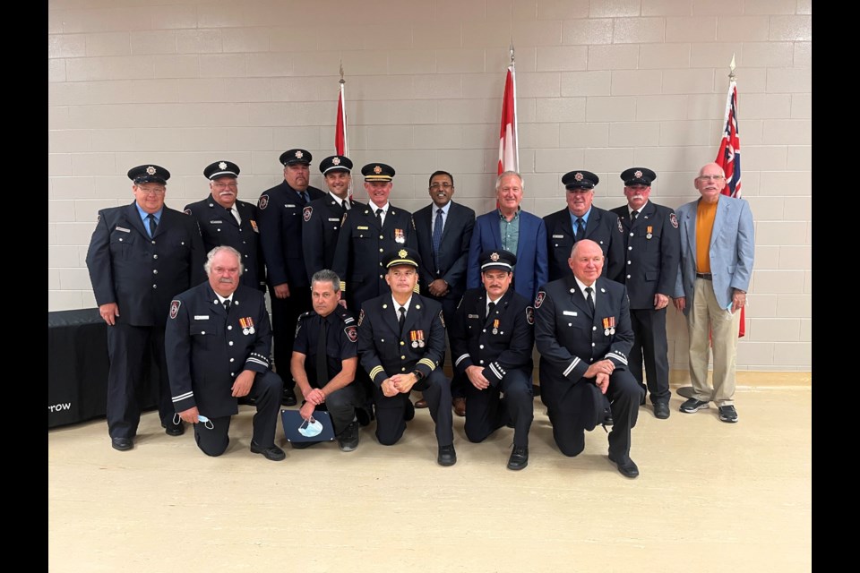 A group picture of all the firefighters honoured, district chiefs, Fire Chief Terry Dixon, CAO Manoj Dilwaria, Mayor Terry Ugulini, and Councillor Fred Neale.