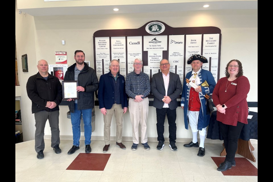 l-r: Councillor Ken Sentance, TCAG Board Director Ken MacQuarrie, Mayor Terry Ugulini, Ontario Trillium Foundation Volunteer William Thompson, MPP Jeff Burch, Town Crier Tony Vandermaas, and TCAG Executive Director Megan Gilchrist. 