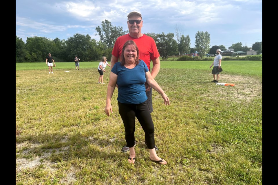 Brad Stemplowski and his sister-in-law Jeanette. Stemplowski has been organizing a neighbourhood game of baseball for the past 18 years. 