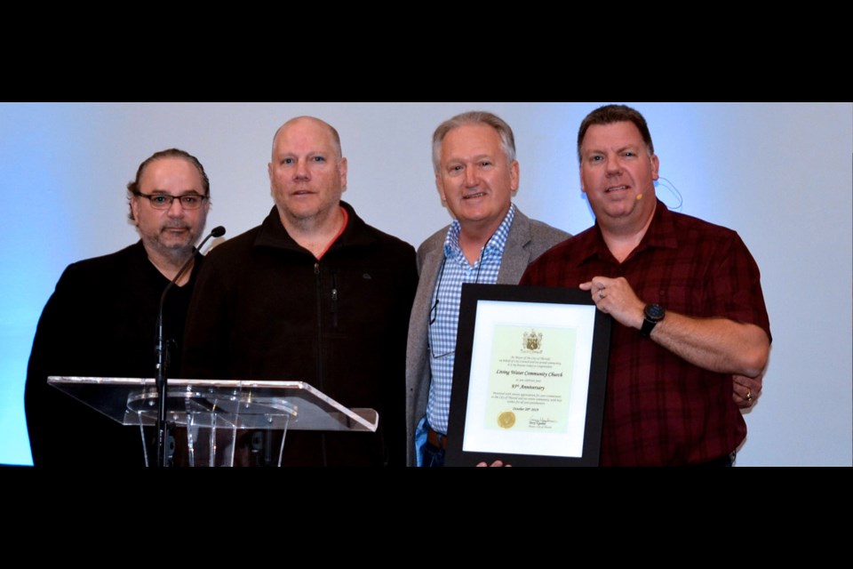 The City presented a certificate acknowledging the anniversary milestone to Pastor Rob Kamerman (r). Presenting were (l-r)  councillors Carmen DeRose and Ken Sentance, along with Mayor Terry Ugulini. Submitted Photo