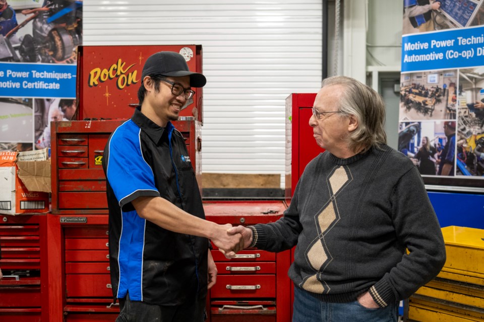 Recent Niagara College Motive Power grad Jessie Boy Dela Rosa and retired auto mechanic Tom Cowan.