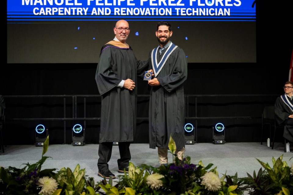 Carpentry and Renovation Technician Program graduate Manuel Felipe Perez Flores is pictured with Leo Tiberi, dean of Media, Trades and Technology at spring 2024 convocation. Flores, a former freelance carpenter from Chile, received the Dean’s Award for achieving the highest GPA in his academic school