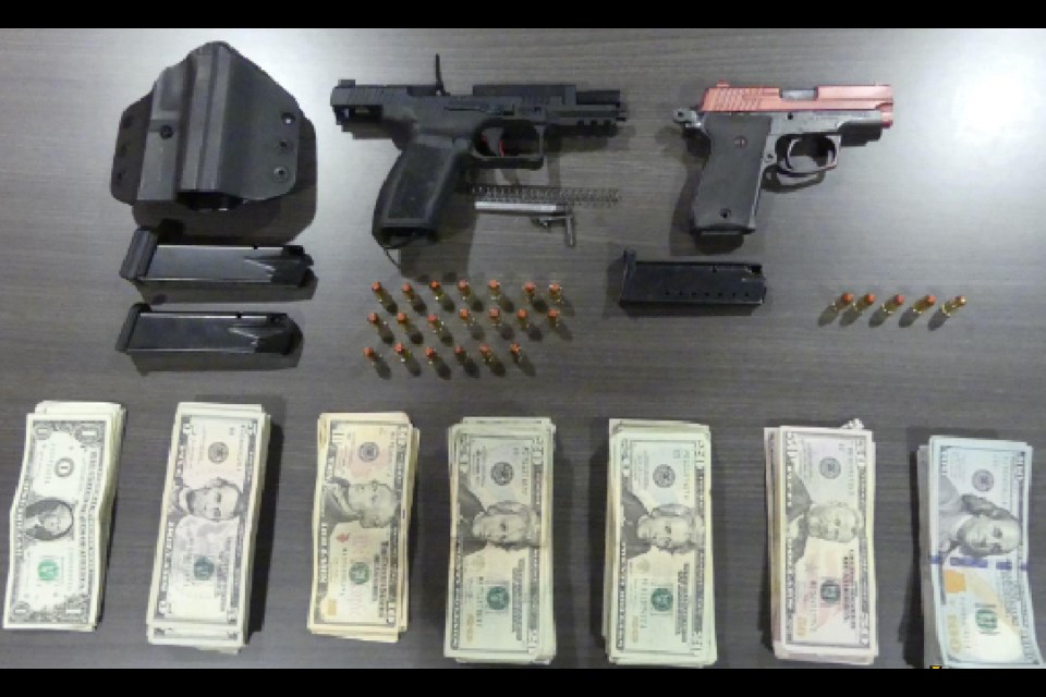 Border services officers discovered two prohibited firearms, 25 rounds of ammunition, two prohibited 18 round firearm magazines, 7 grams of suspected cocaine, 3.1 grams of suspected crystal methamphetamine, and $9,997 of American currency