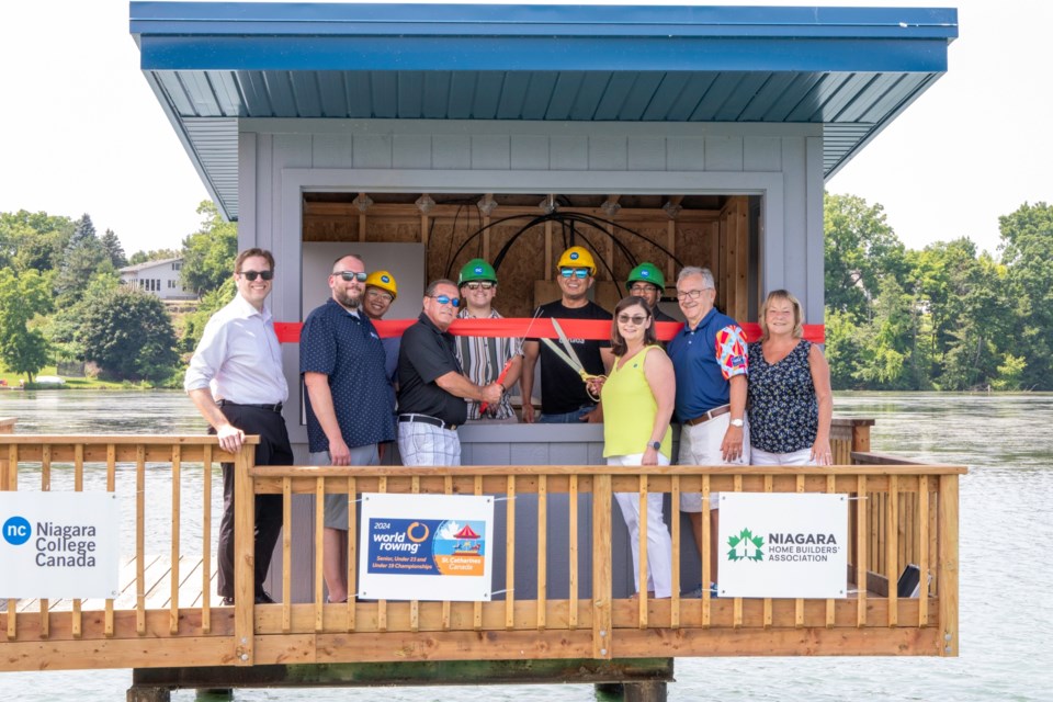 Front row (L to R): MP Chris Bittle, NC Carpentry instructor Julian Ledonne, CEO of the NHBA Chuck McShane, NC Vice-President, Academic, Fiona Allan, Honorary President of the 2024 World Rowing Organizing Committee and Regional Councilor Tim Rigby, MPP Jennie Stevens. Back row (L to R): NC students Linh Lawrenn, Landon Consonni, Kevin Huang, and Rishi Loorkhoor.