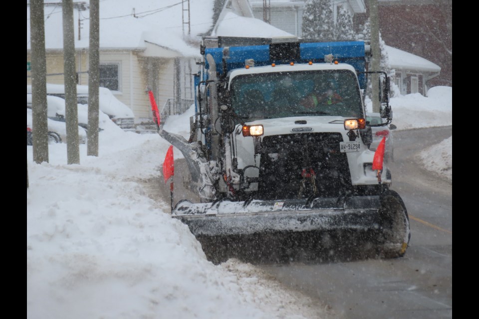 A plow clearing the snow in Thorold.